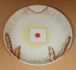 A plate, two hands and a square